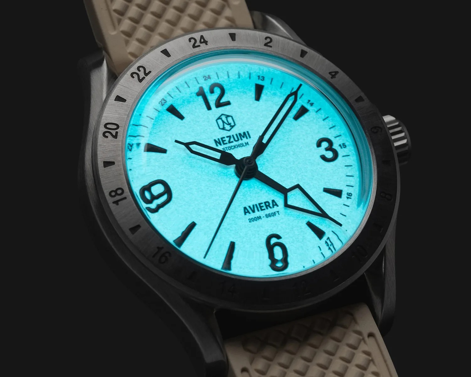 a nezumi gmt watch with a dial glowing in the dark