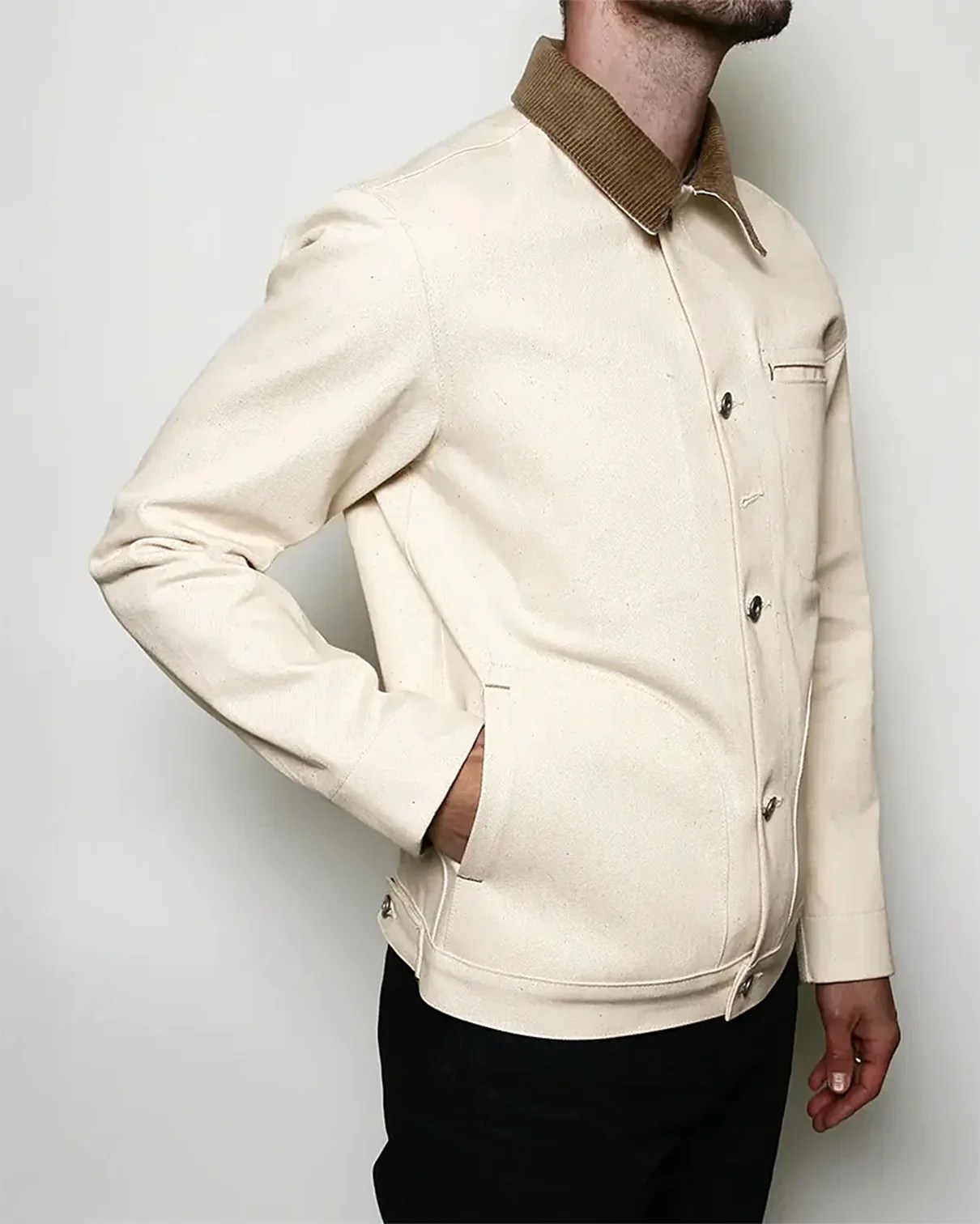 a man in a white denim jacket