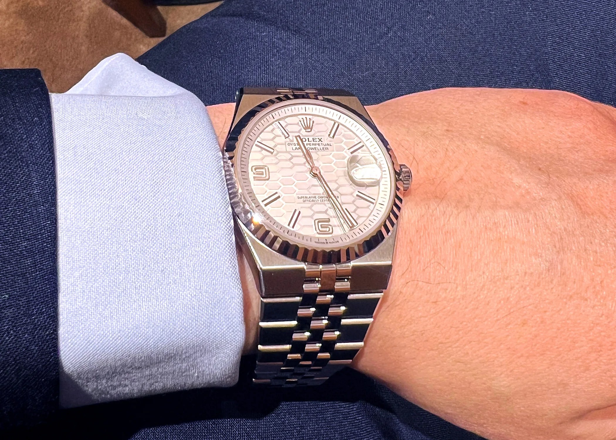 a rolex watch on a mans wrist