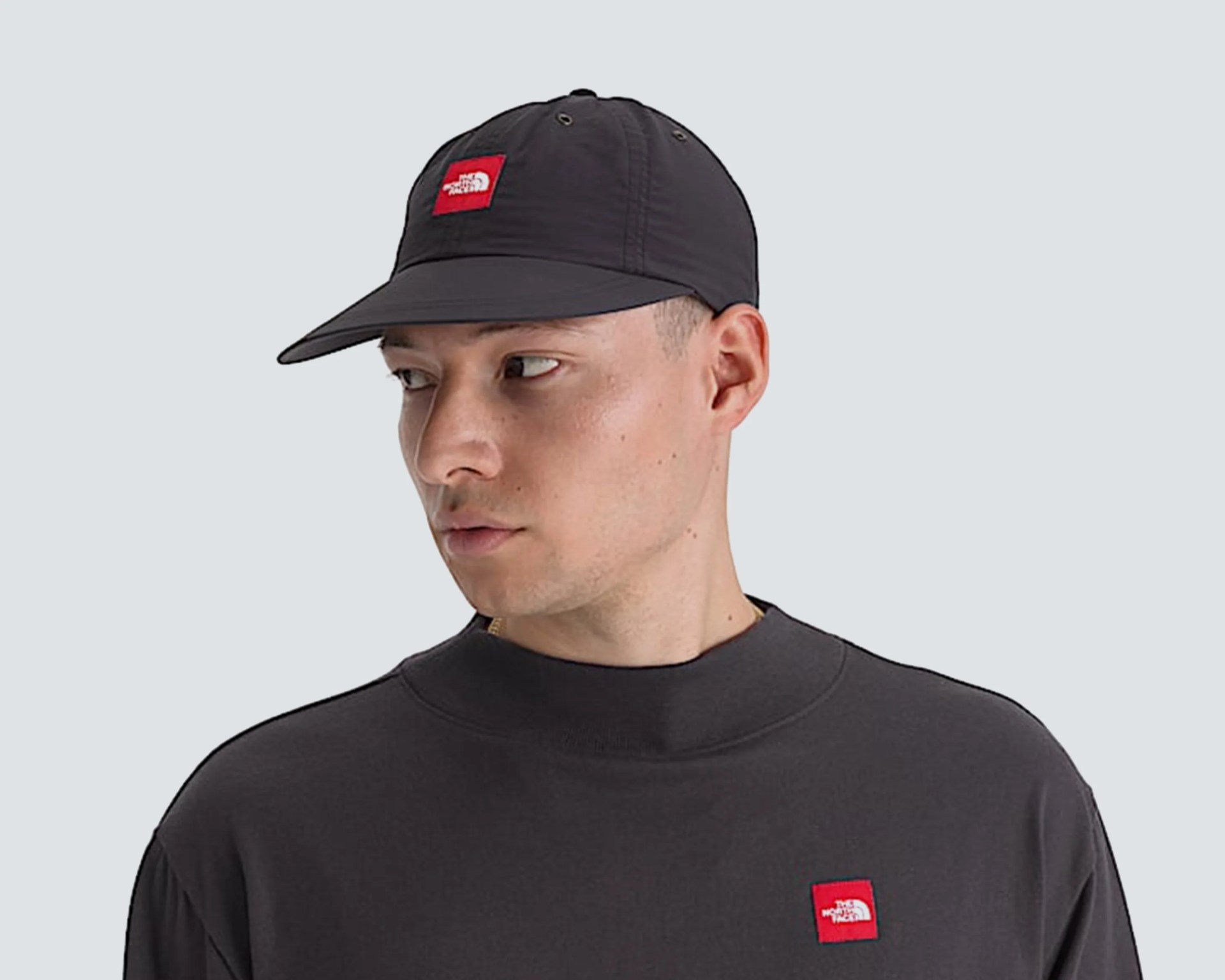 man wearing the north face hat and shirt