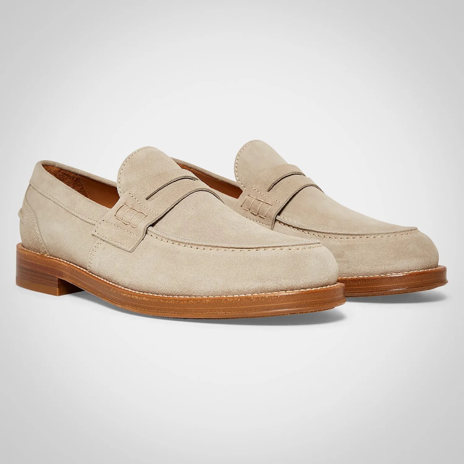 a pair of suede loafers