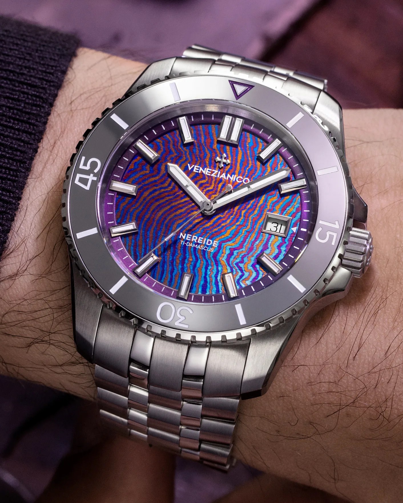 a watch with a purple dial