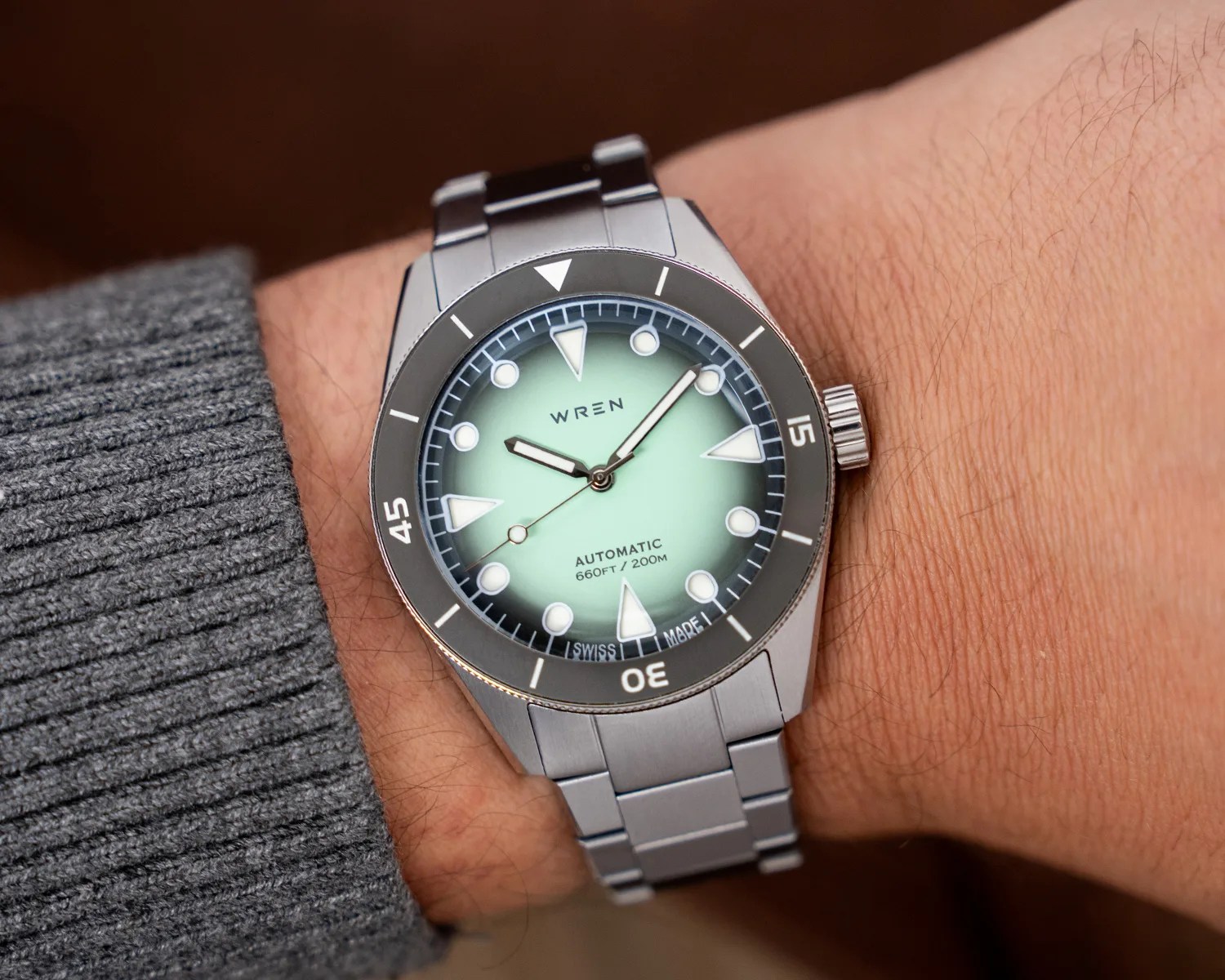a wren dive watch on a mans wrist