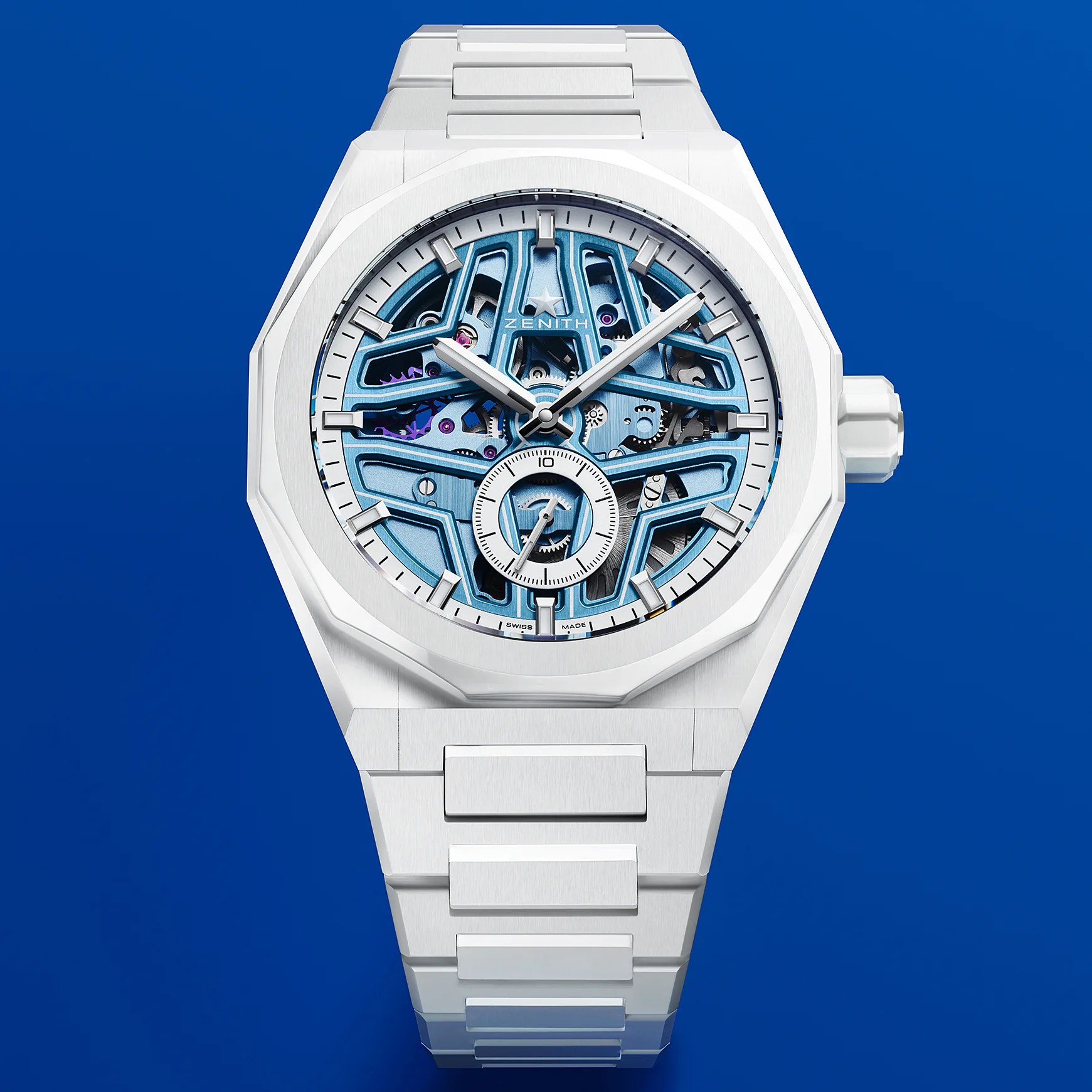 a white Zenith watch with a skeletonized dial
