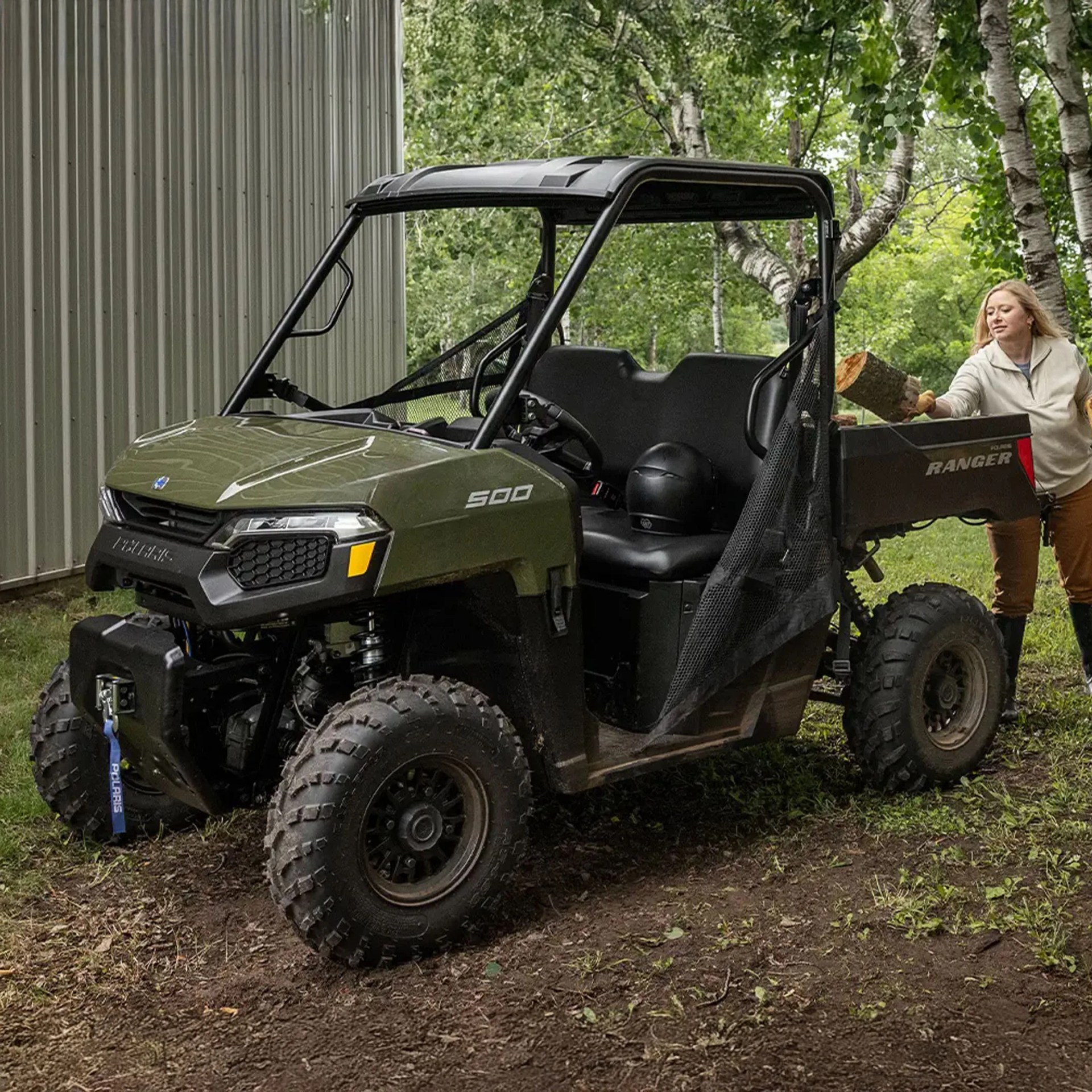 2026 Polaris Ranger 500 with woman loading lumber into back