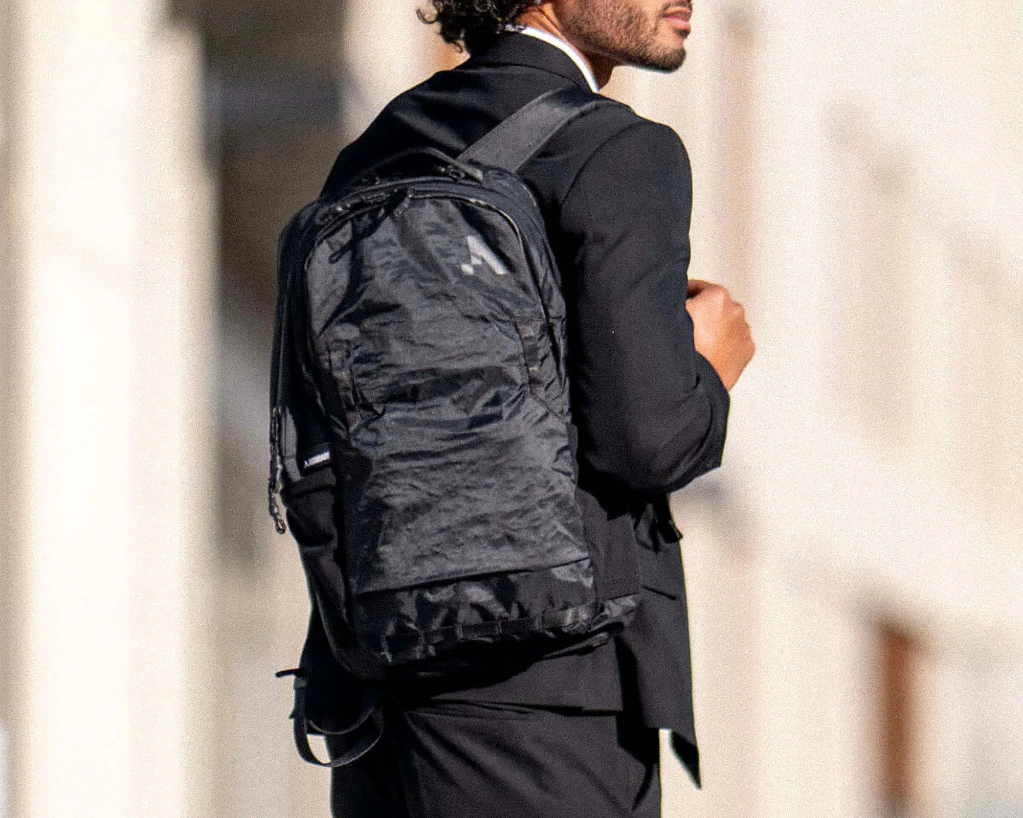 Boundary Supply X-Pac EDC Bag on person wearing suit outside