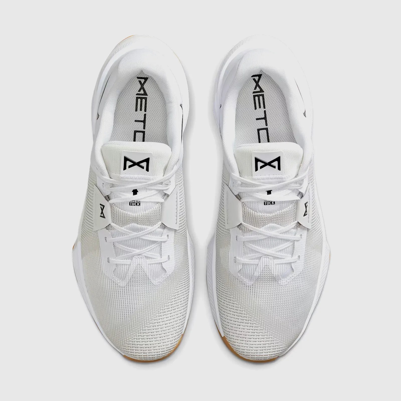 A top down view of a pair of Nike Metcon 10 gym shoe in white 