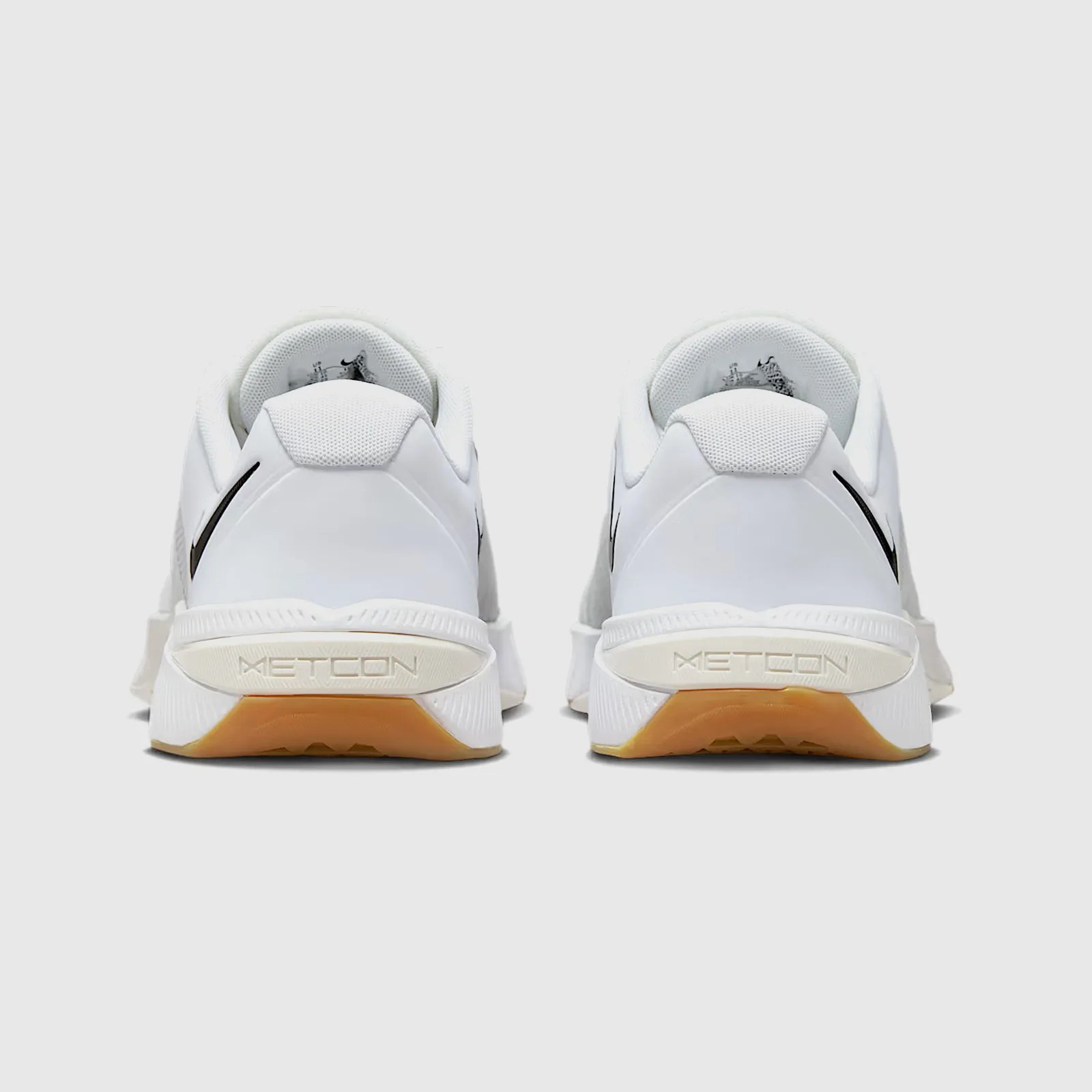 A look at the heels of a pair of Nike Metcon 10 gym shoes in white