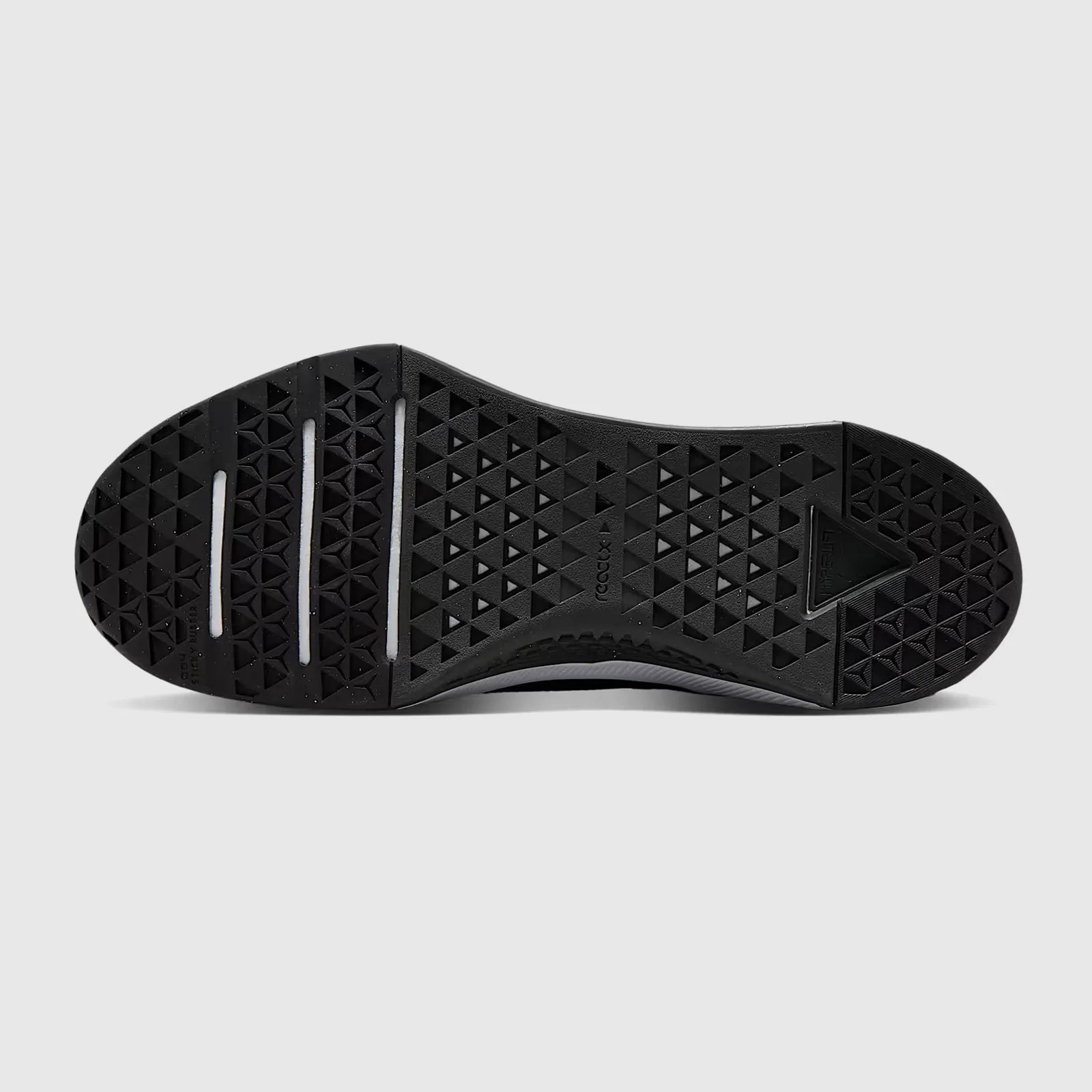 A single Nike Metcon 10 gym shoe shown flipped on its side so that the sole is facing straight on