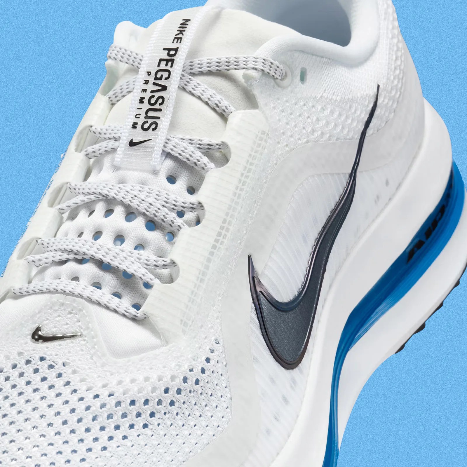 A close-up of the upper of the Nike Pegasus Premium in white and photo blue