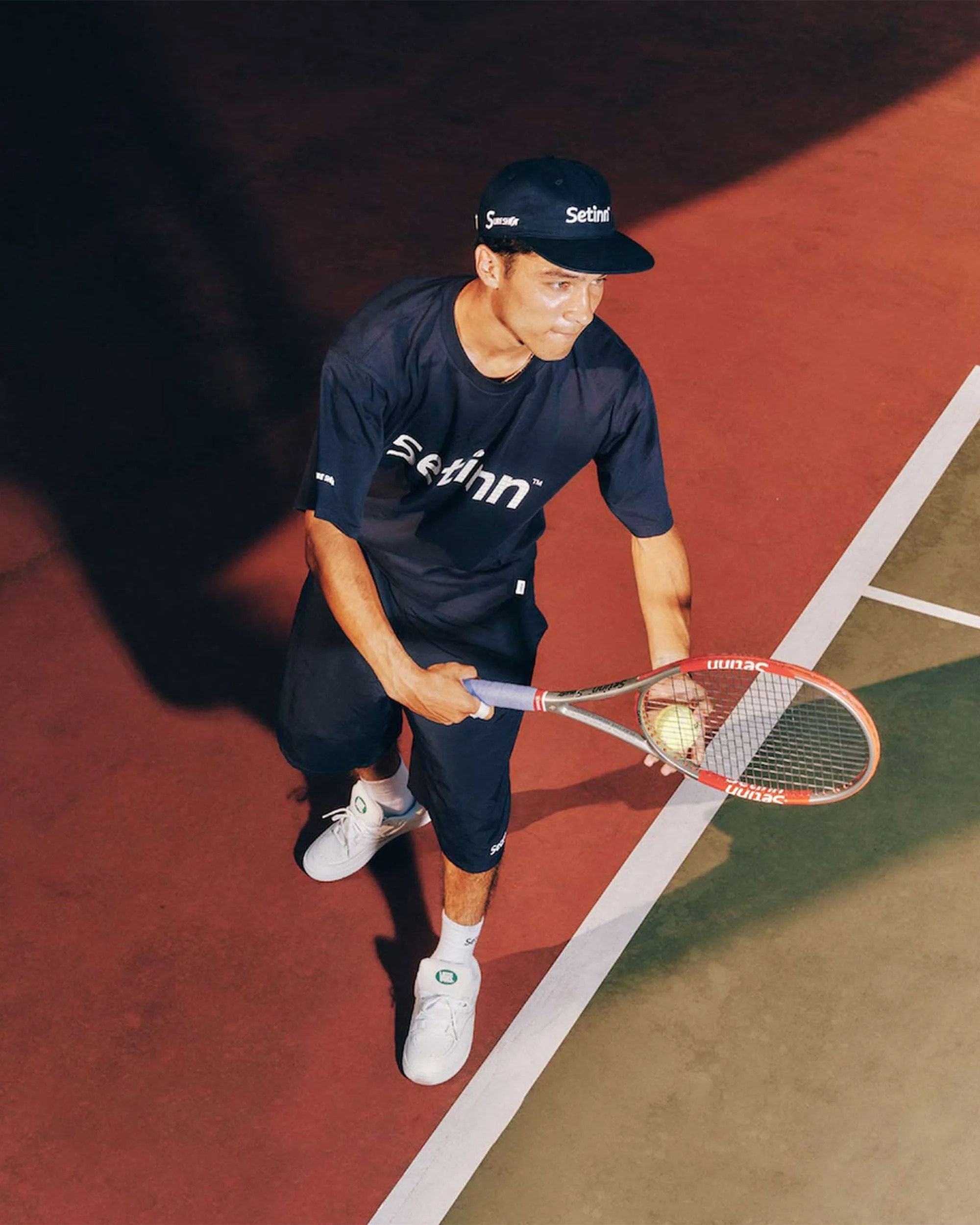 Tennis player wearing Vans x Setinn Capsule Collection