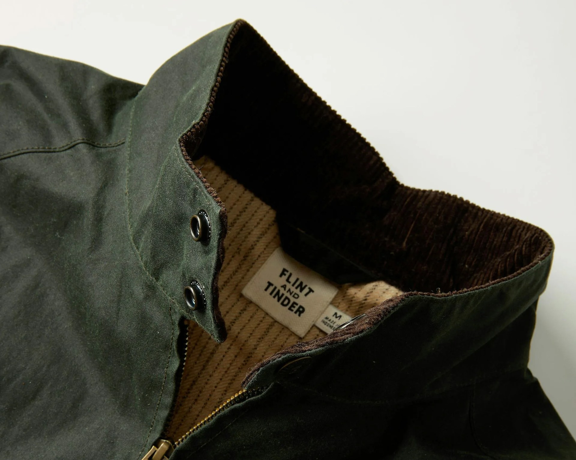 the neck of a waxed harrington jacket