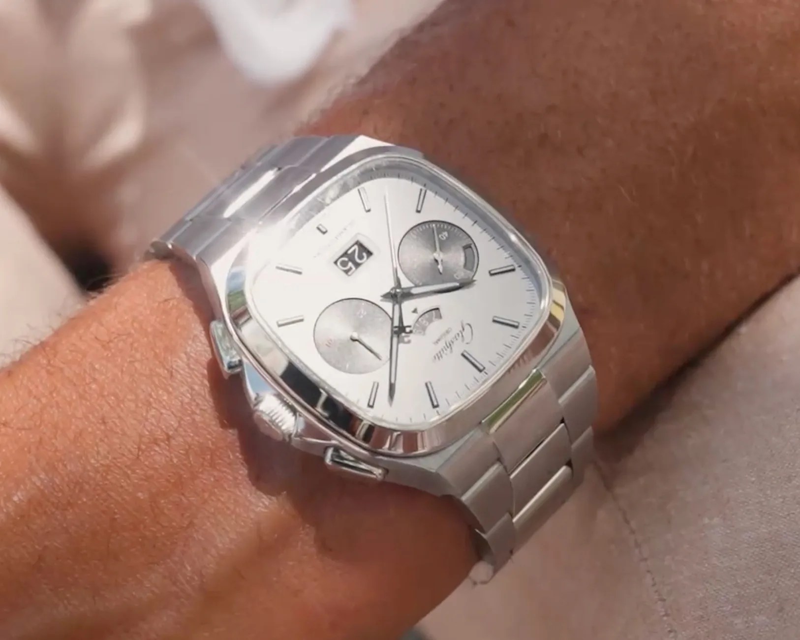a Glashutte watch on a man's wrist