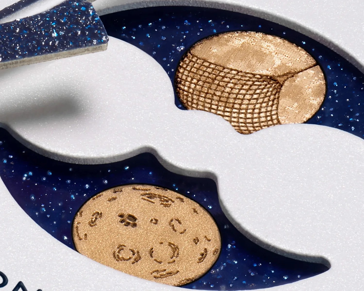 a closeup of the moonphase indicator on a moonswatch watch