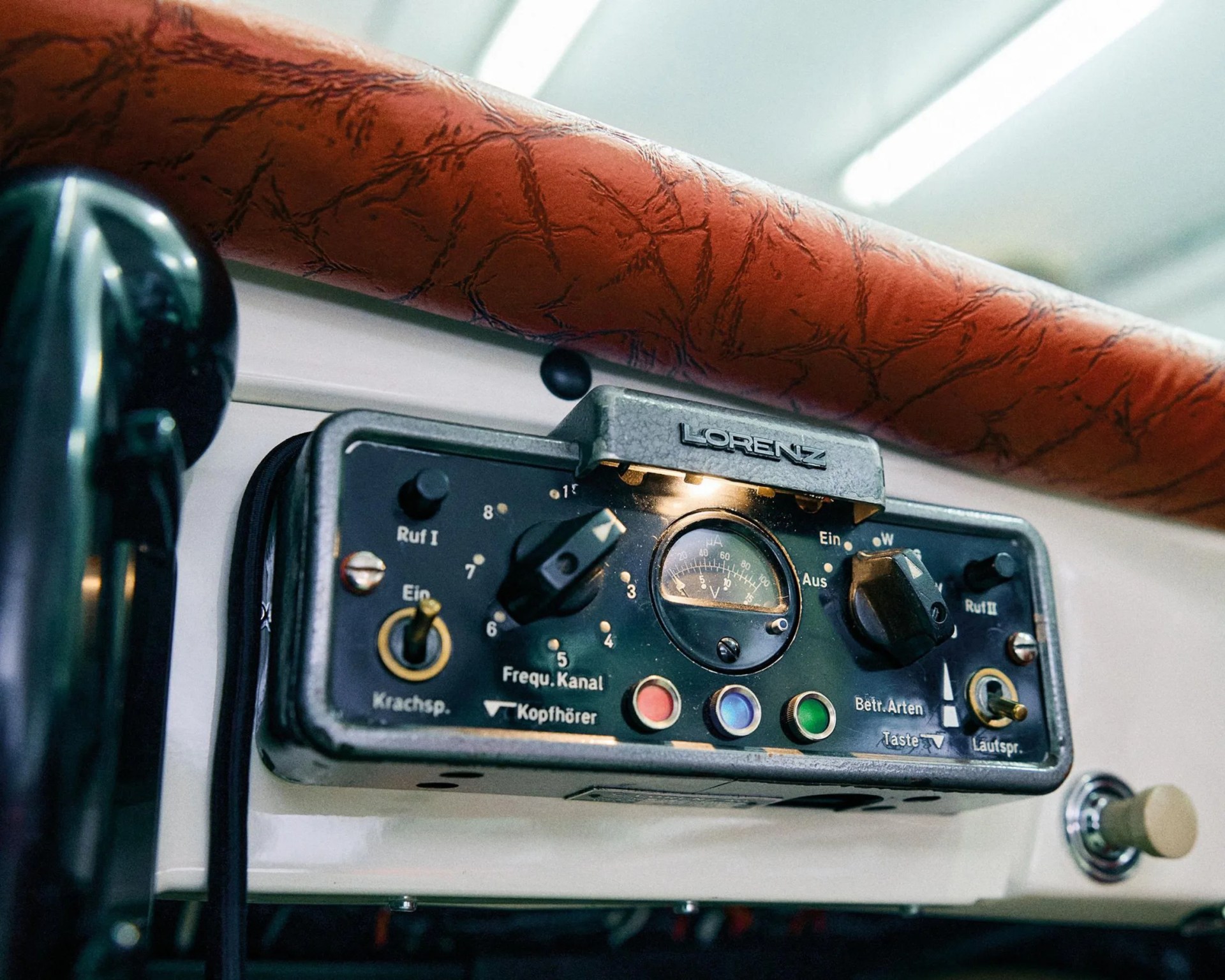 a photo of a vintage lorenz car phone system installed in a porsche sports car